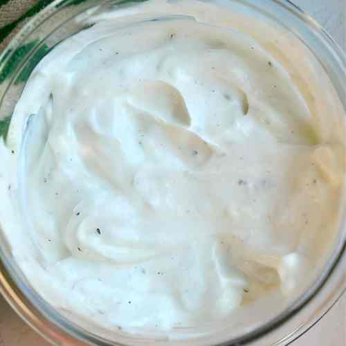 white and creamy 2 ingredient ranch dip in a glass dish