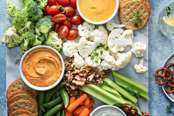 table of veggies hummus and crackers